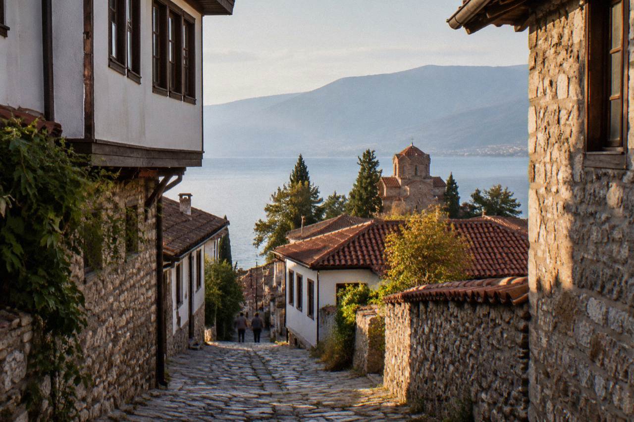 A narrow stone lane in Ohrid old town with traditional houses above the lake