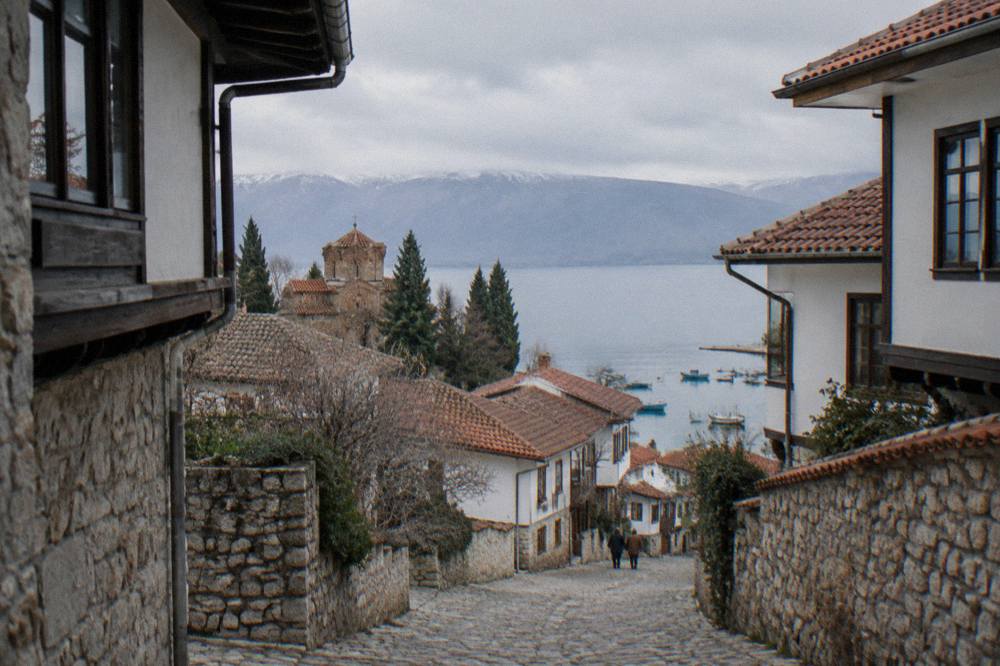 Small boats moored along the Ohrid lakefront on a calm morning