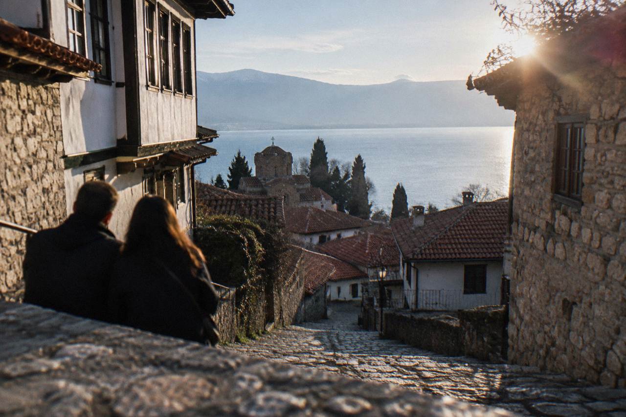 A couple's view over the red roofs of Ohrid old town and the blue water of Lake Ohrid