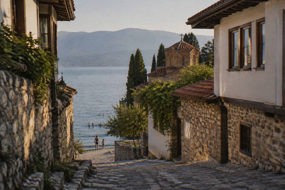 A family swimming from a pebble beach on Lake Ohrid near Ohrid old town