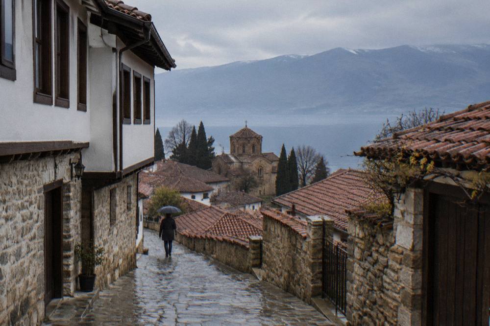View across the red roofs of Ohrid old town toward the blue water of Lake Ohrid
