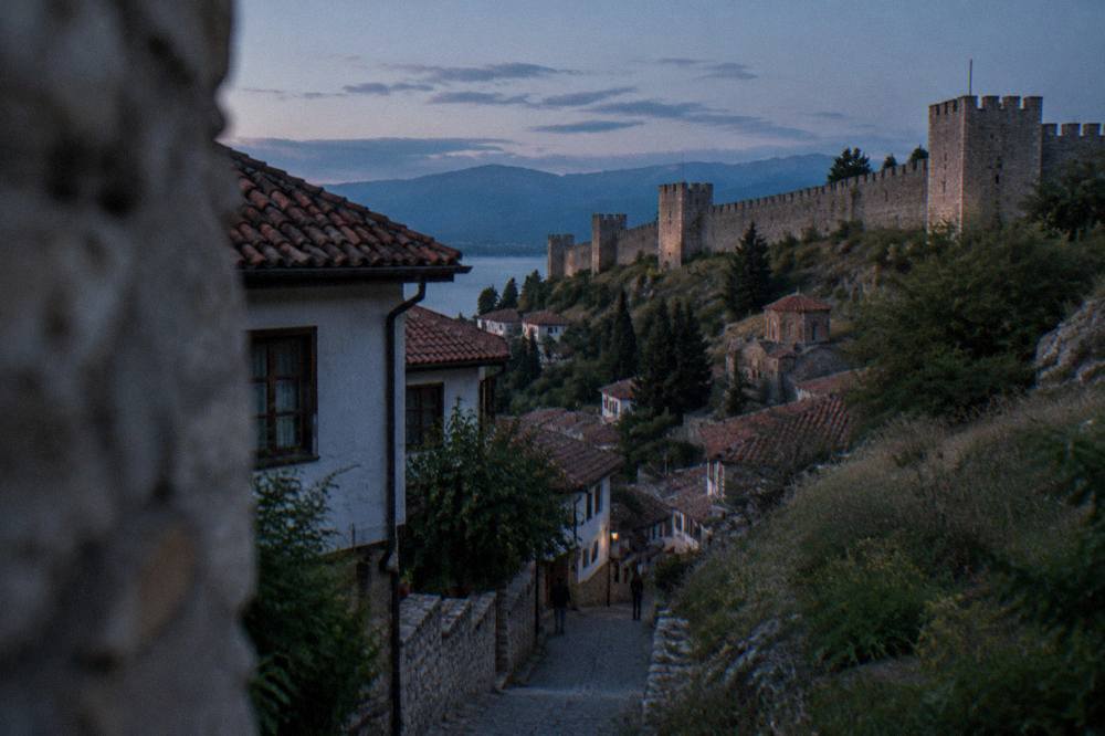 A quiet lane of traditional Ohrid houses below the fortress walls