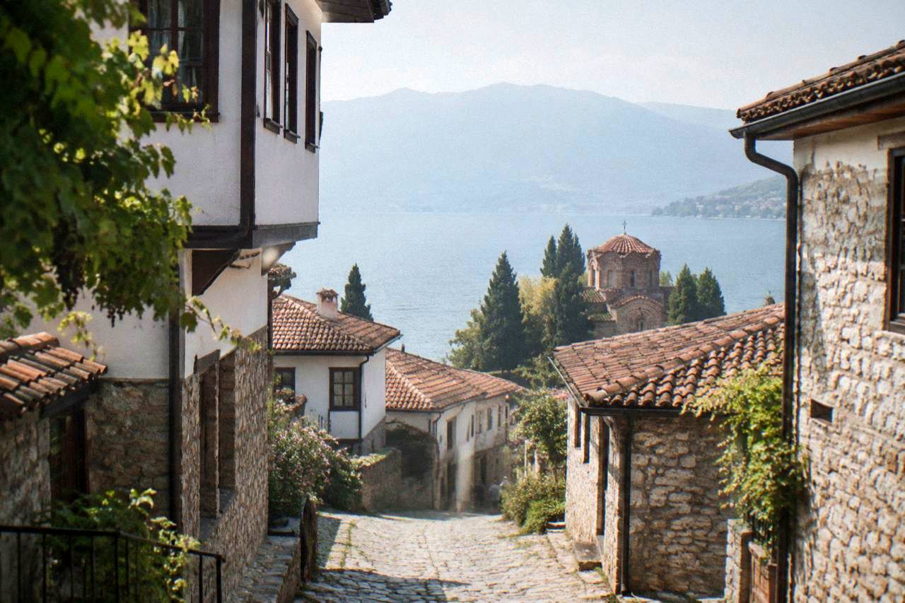Stone lanes of Ohrid old town rising from the lake shore toward the fortress walls