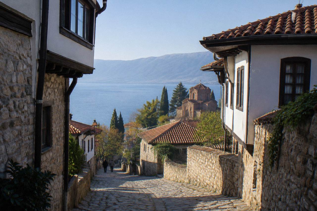 The old town of Ohrid rising above the blue water of Lake Ohrid under a clear sky