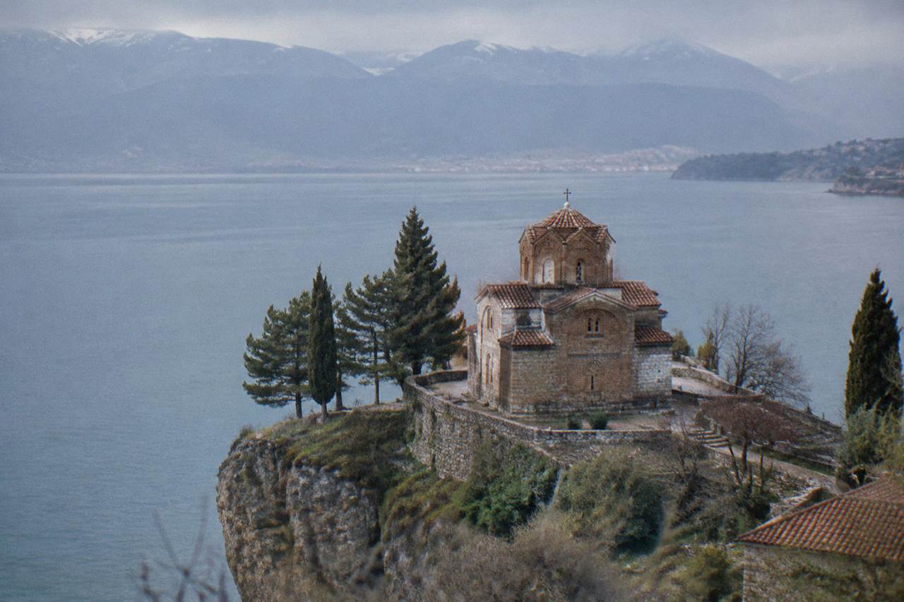 The Church of St John at Kaneo standing on a cliff above the blue water of Lake Ohrid