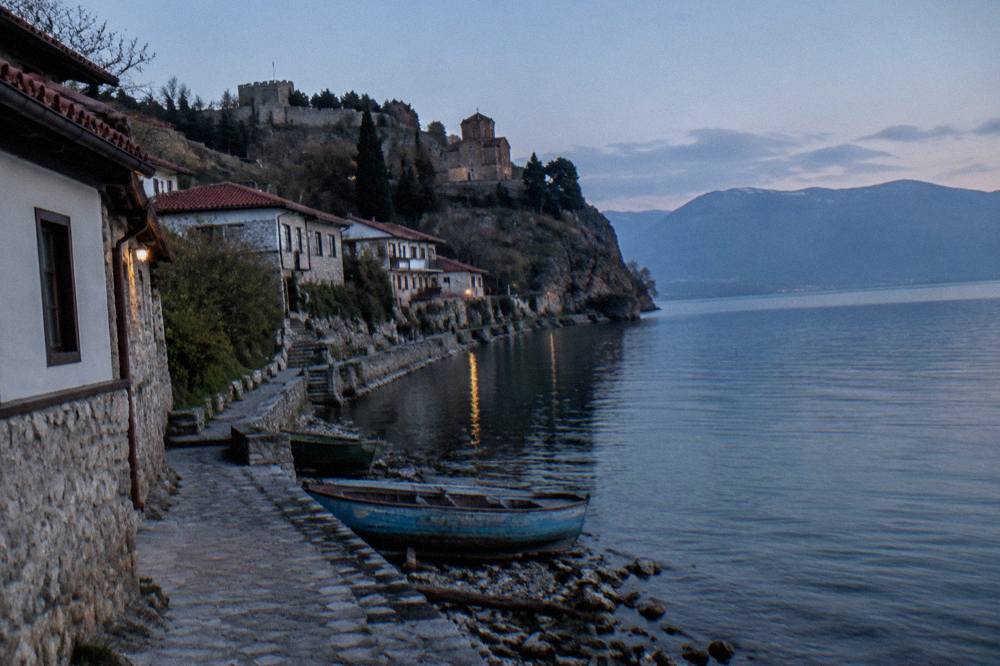 Stone lanes and steps climbing from the lakeshore through the Kaneo district toward the Ohrid old town