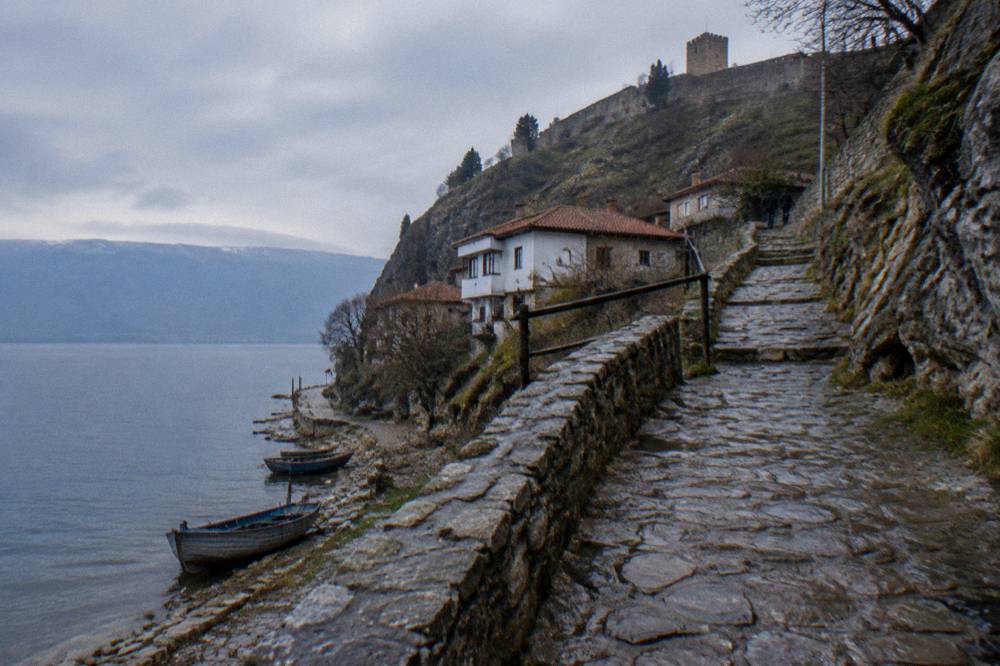 A cliff path above Lake Ohrid climbing from the Kaneo district toward the walls of Samuel's Fortress