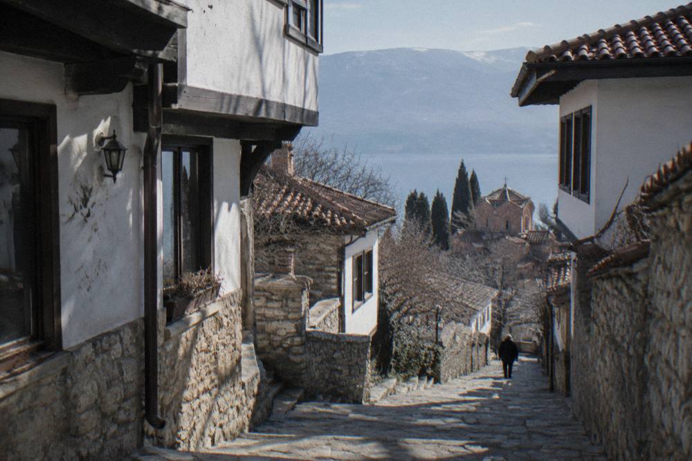 A stepped stone lane between whitewashed houses in the Ohrid old town