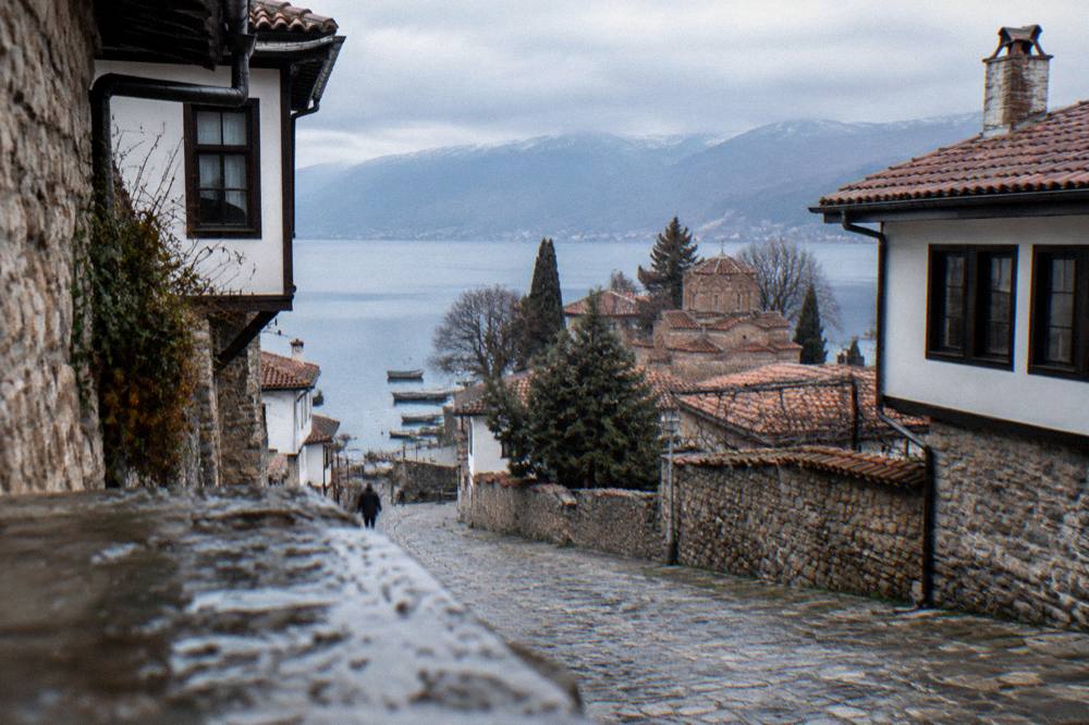 The lake shore promenade below the old town with small boats and stone quays
