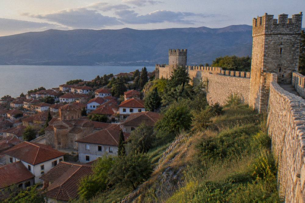 Evening light on the fortress walls above the rooftops of Ohrid