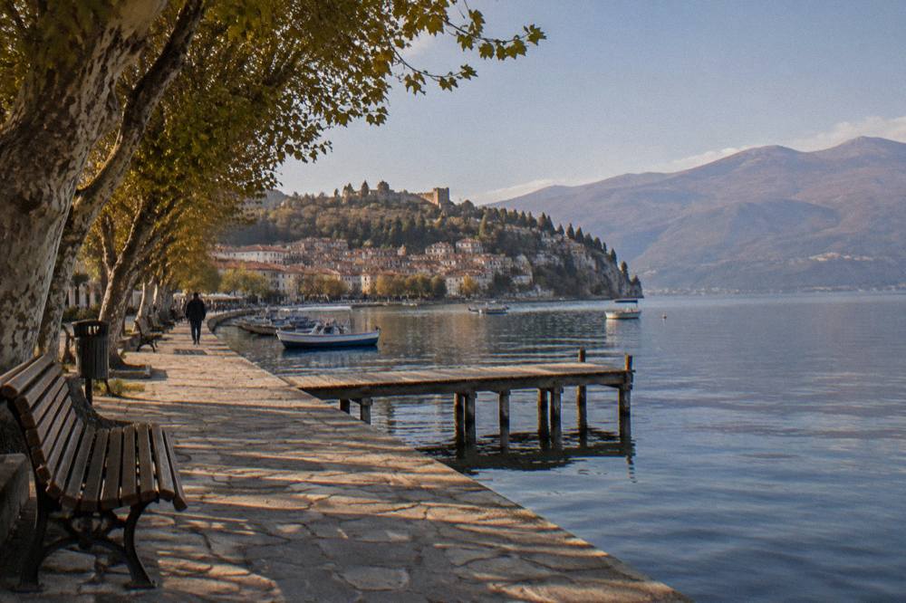 The lakeside promenade in Ohrid with boats moored along the shore