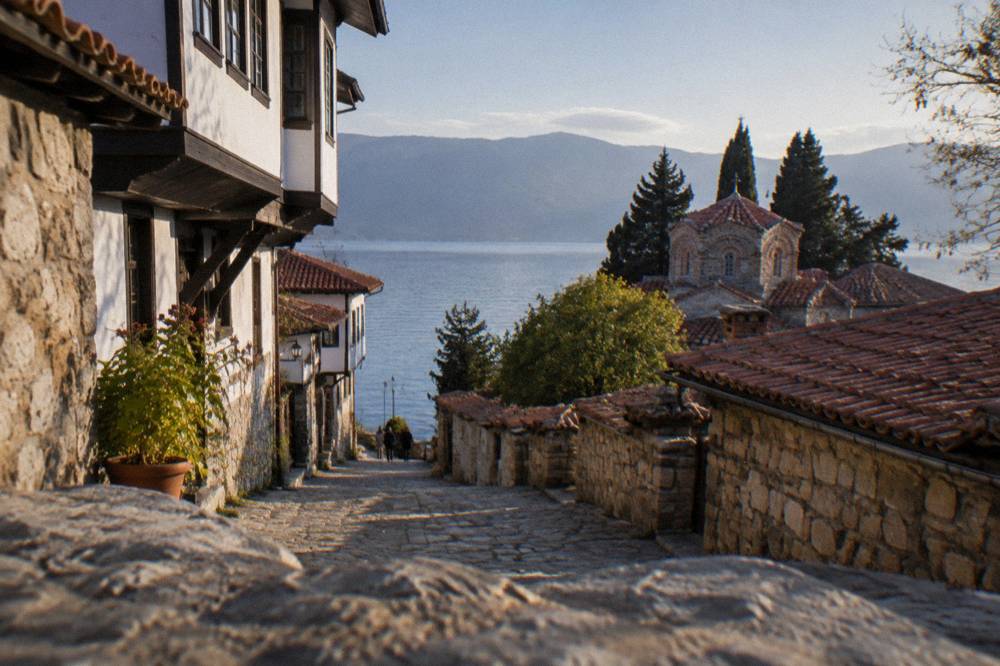 Evening light on the calm surface of Lake Ohrid seen from the promenade