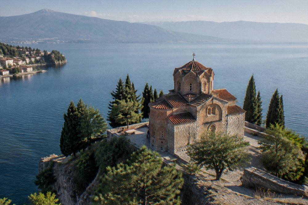 Sunset over Lake Ohrid with the silhouette of the Church of St John at Kaneo