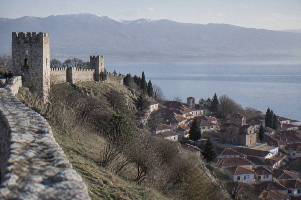 View from fortress walls over Ohrid's rooftops to the lake and distant mountains