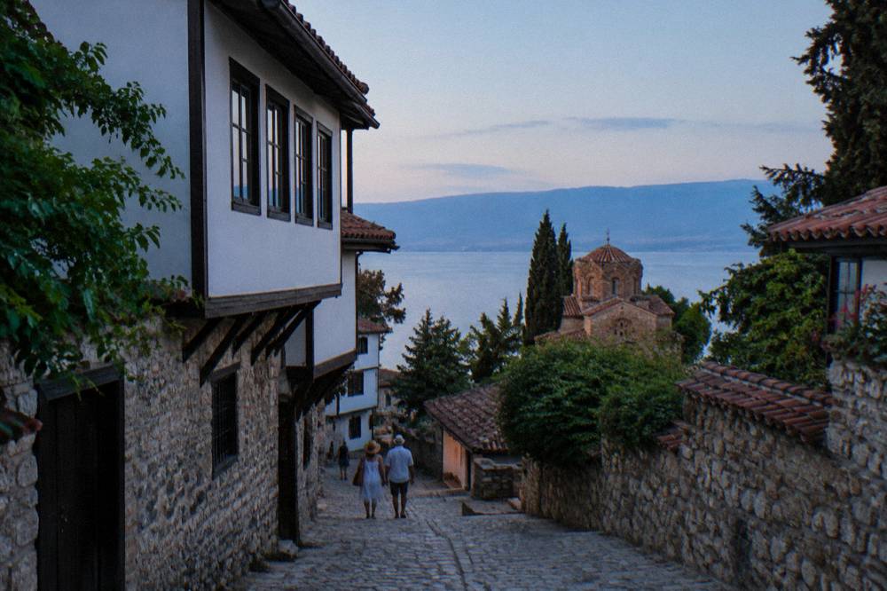 An ancient stone theatre seating curve below the fortress hill in Ohrid