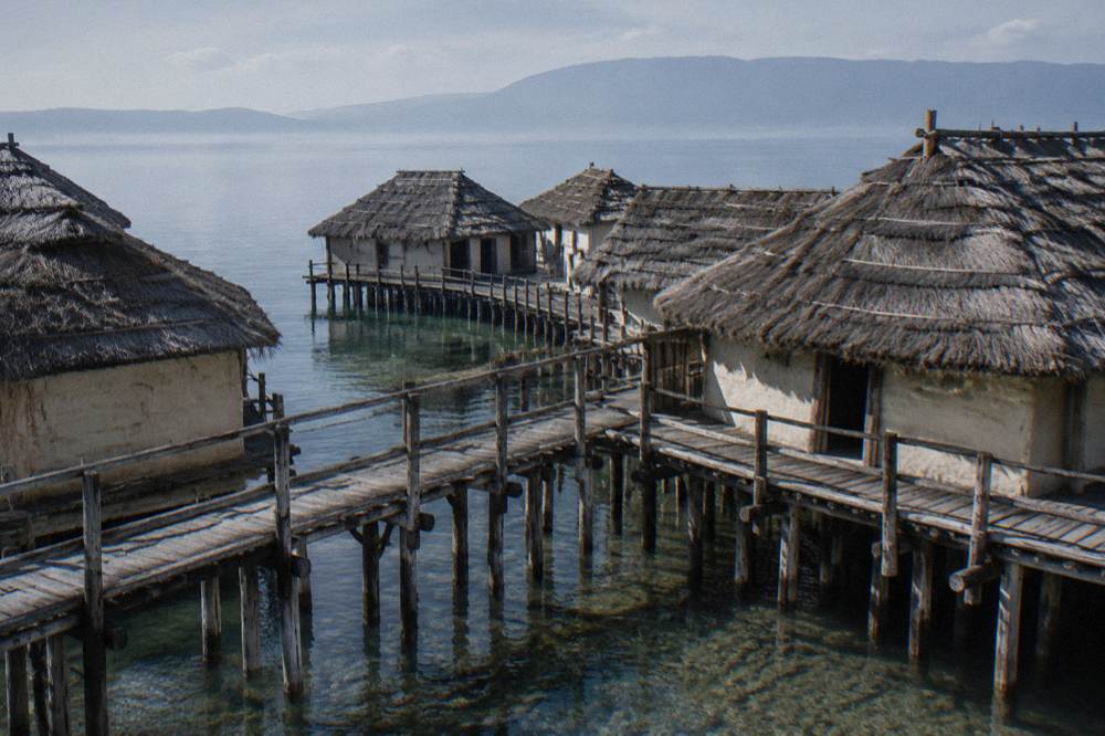 Wooden pile dwellings of the Bay of Bones museum standing in Lake Ohrid