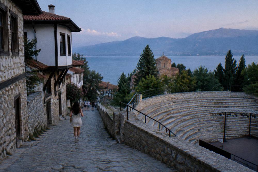 Open-air stone theatre seating prepared for an evening performance