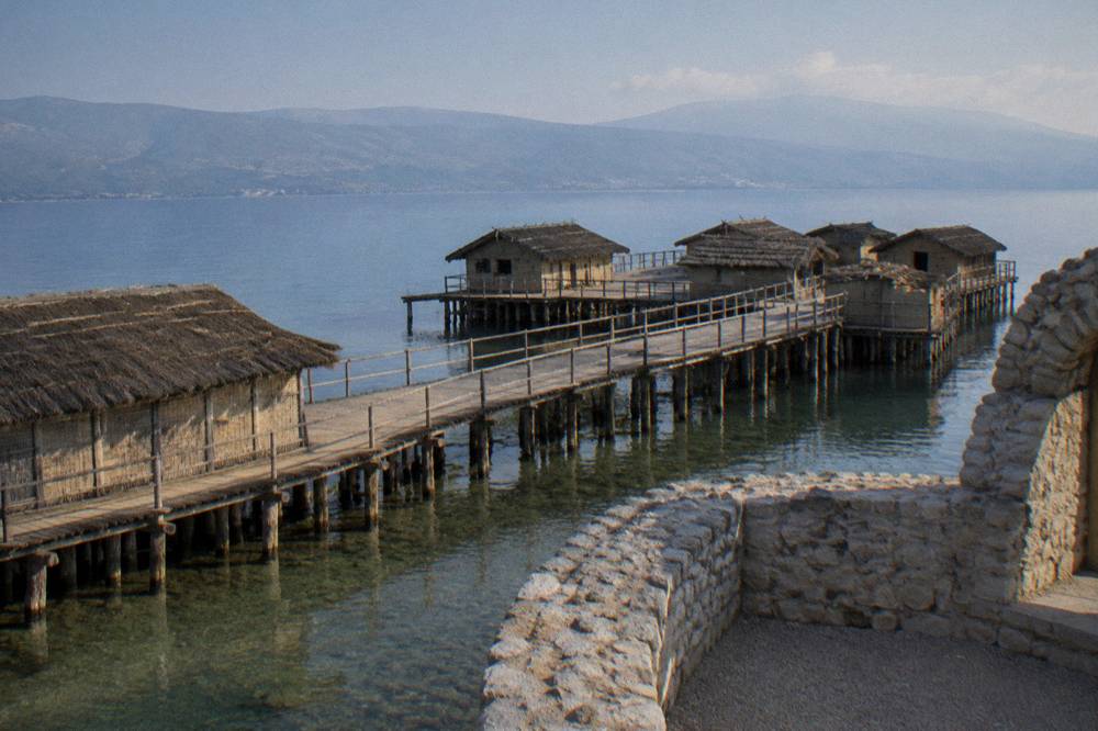 The reconstructed pile dwellings of the Bay of Bones museum on the water near Peshtani