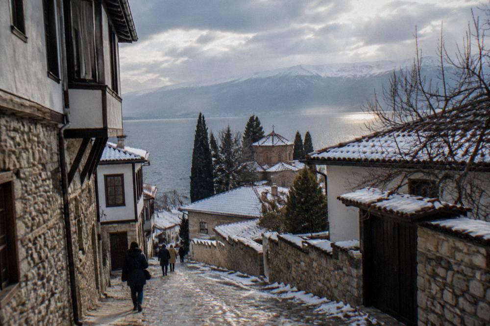 Snow-dusted rooftops of Ohrid with the lake in low winter light