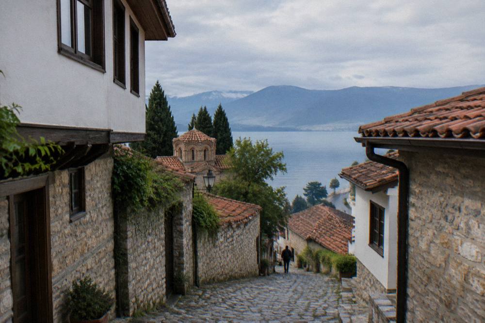 Clouds over Lake Ohrid with the shore road visible along the water