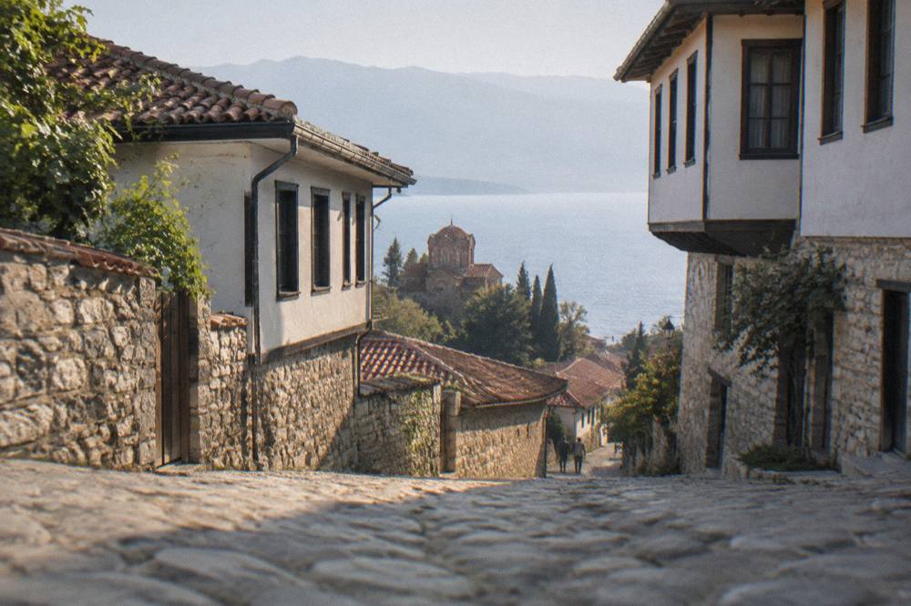 Evening light over the rooftops of Ohrid and the calm surface of Lake Ohrid