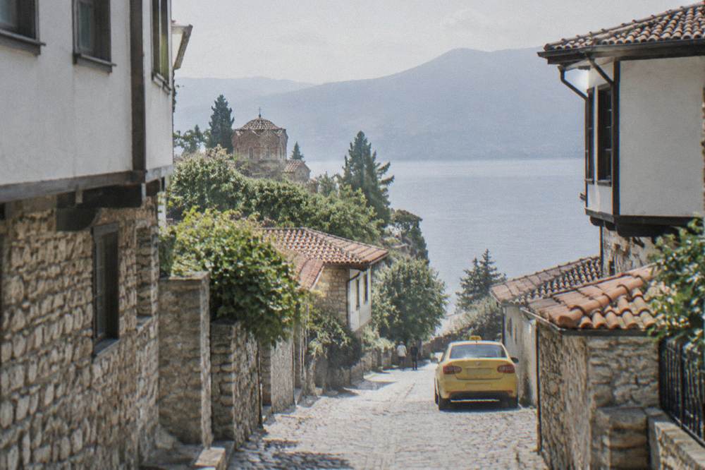 A taxi waiting on a street in Ohrid near the lake shore