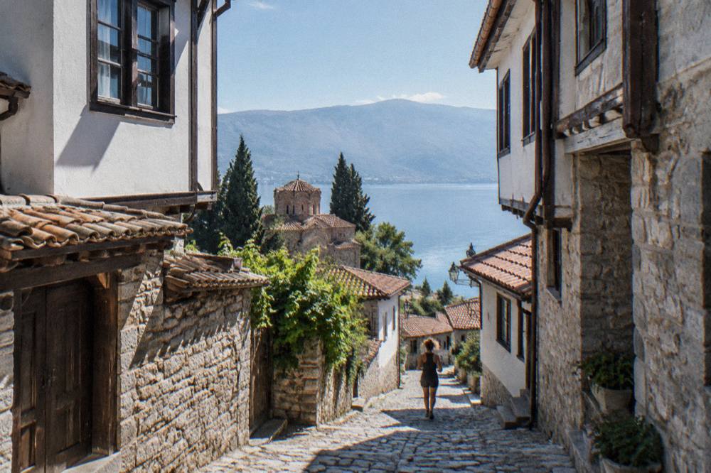 Clear turquoise water over pale pebbles at a Lake Ohrid swimming spot