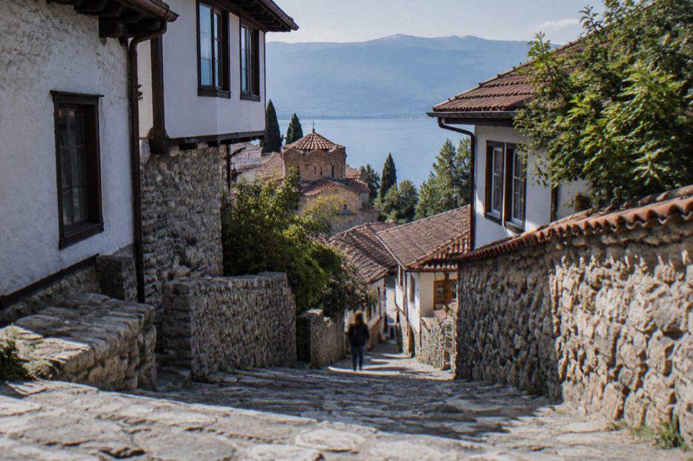 Narrow stone steps climbing between old houses in Ohrid's old town