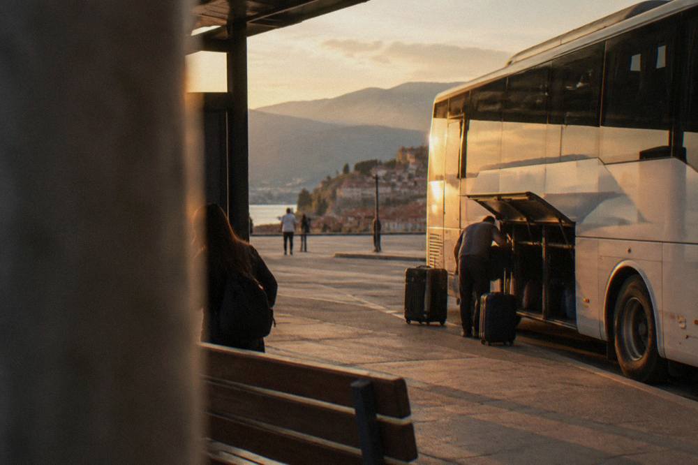 A bus parked at the Ohrid bus station with luggage being loaded
