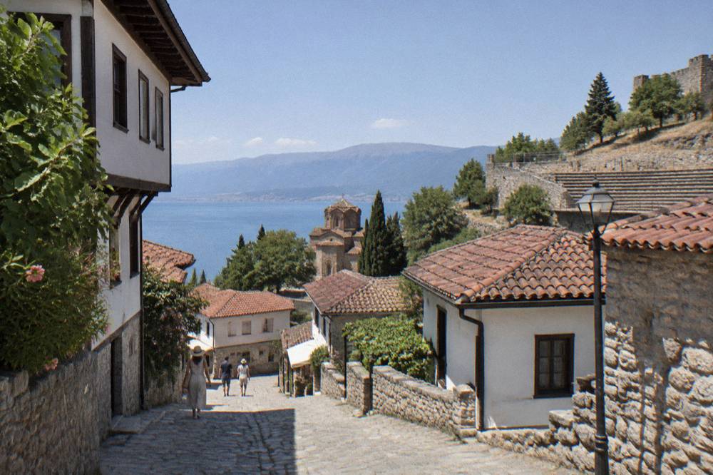 Ancient stone seating rows of the late Hellenistic theatre above the old town rooftops