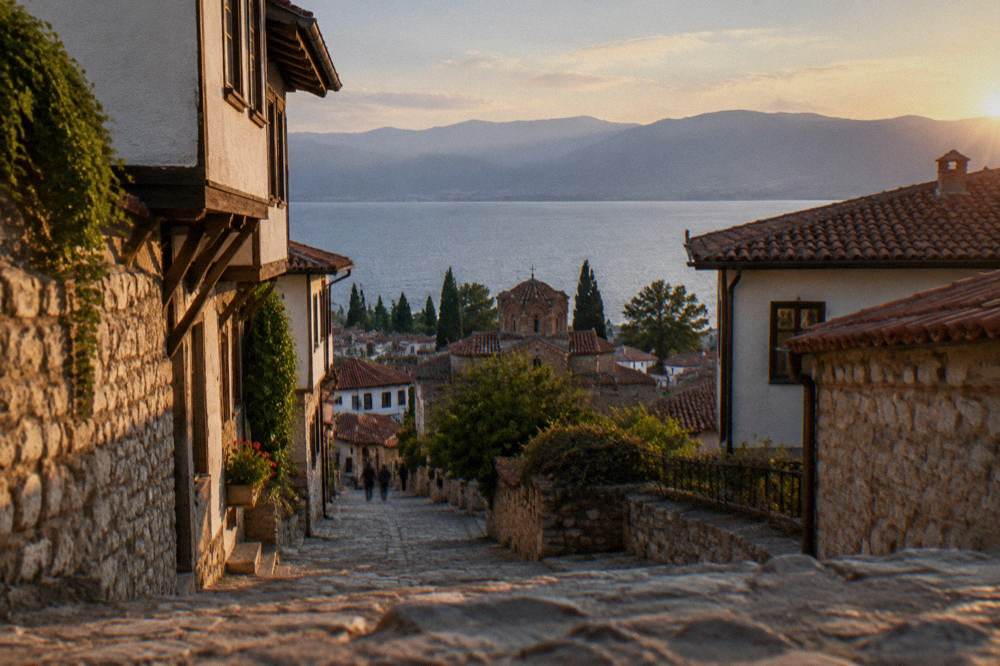 Evening light over rooftops and the expanse of Lake Ohrid beyond Ohrid town
