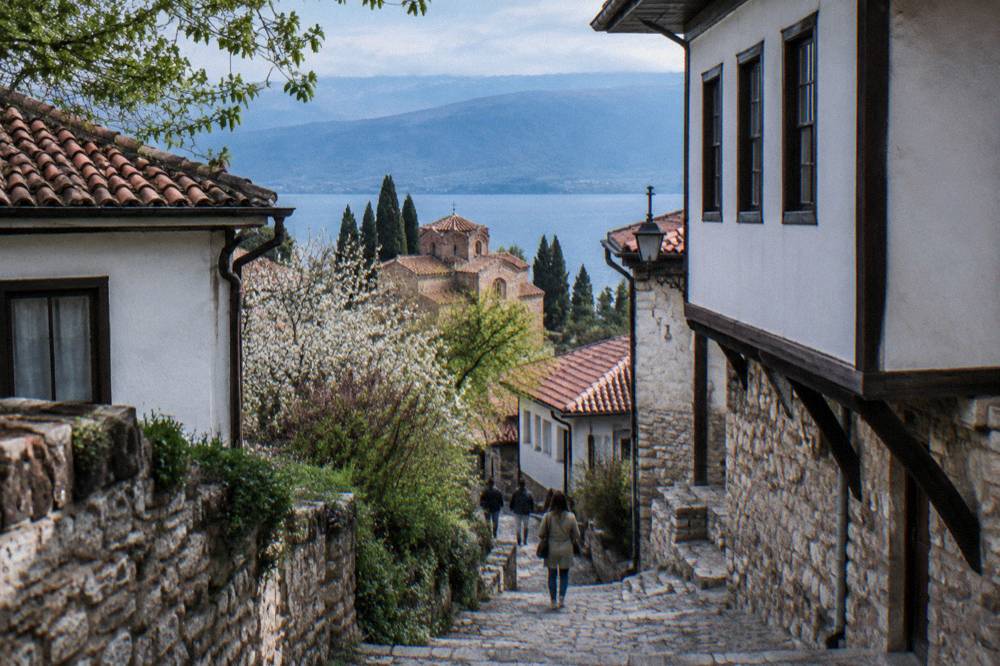 Stone steps climbing between old houses toward Samuel's Fortress in Ohrid