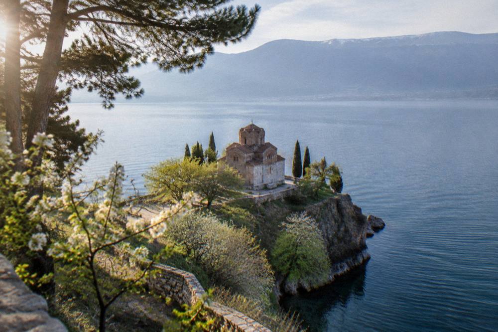 Church of St John at Kaneo seen across the water on a calm spring morning