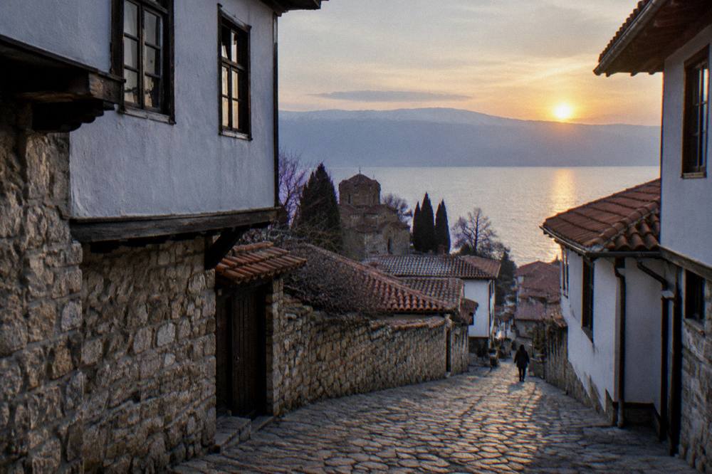 Sunset over the tiled roofs of Ohrid old town and the lake beyond