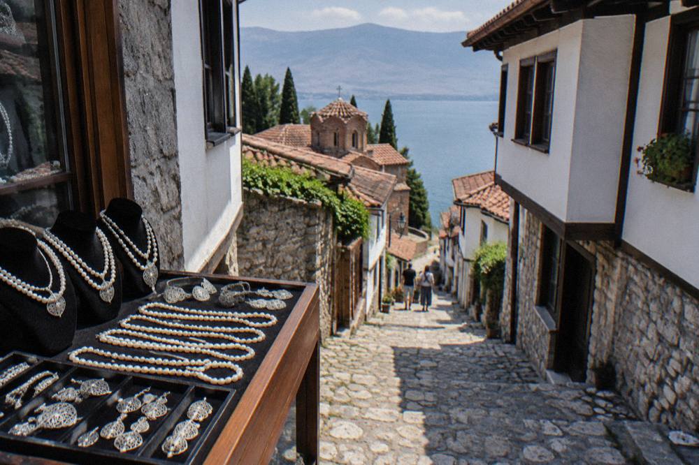 A jeweller's display of Ohrid pearl necklaces and filigree silver on a shop counter