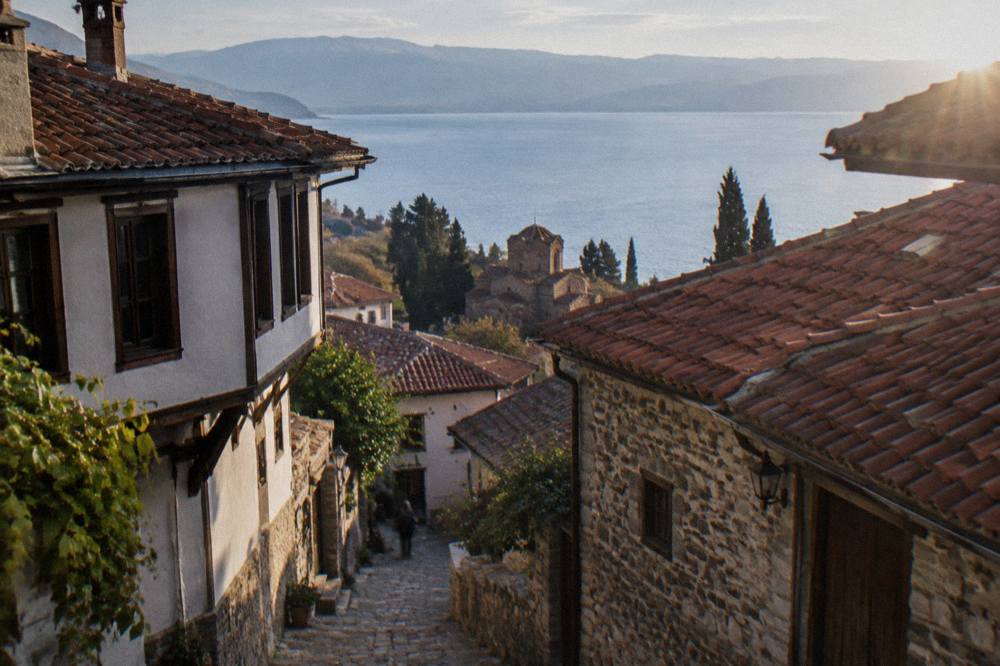 View over red roofs of Ohrid old town and the blue lake beyond