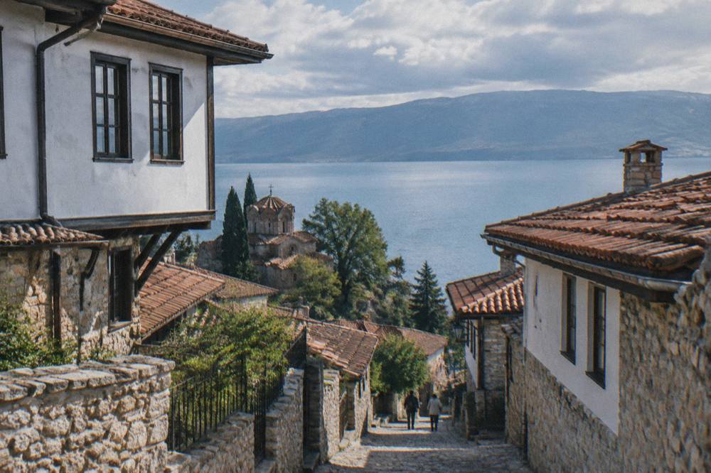 Red-tiled roofs of Ohrid old town above the blue water of Lake Ohrid