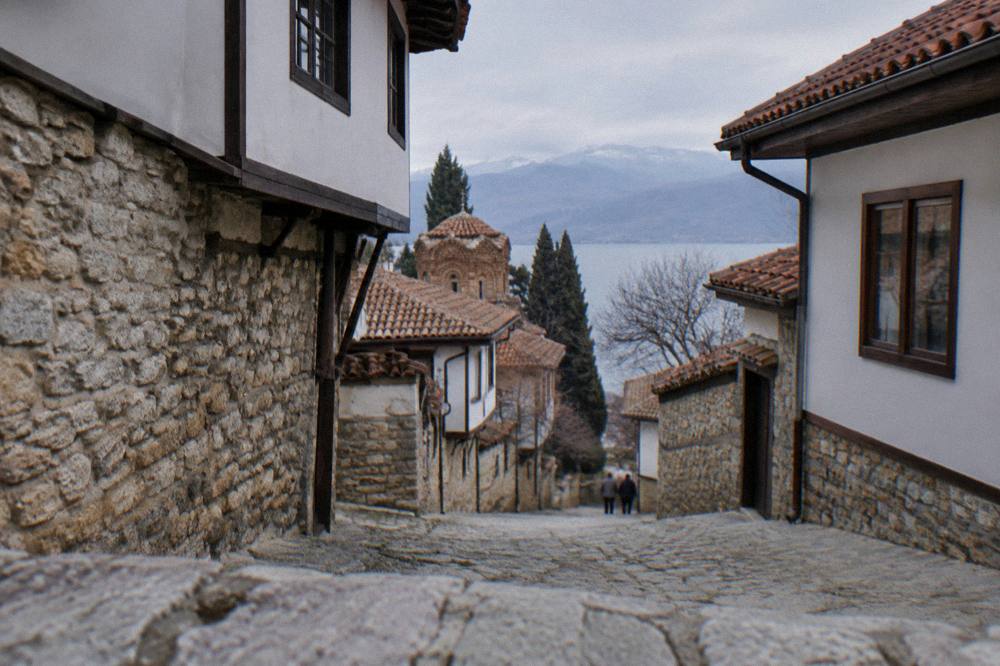 A narrow stone lane with old houses in Ohrid old town