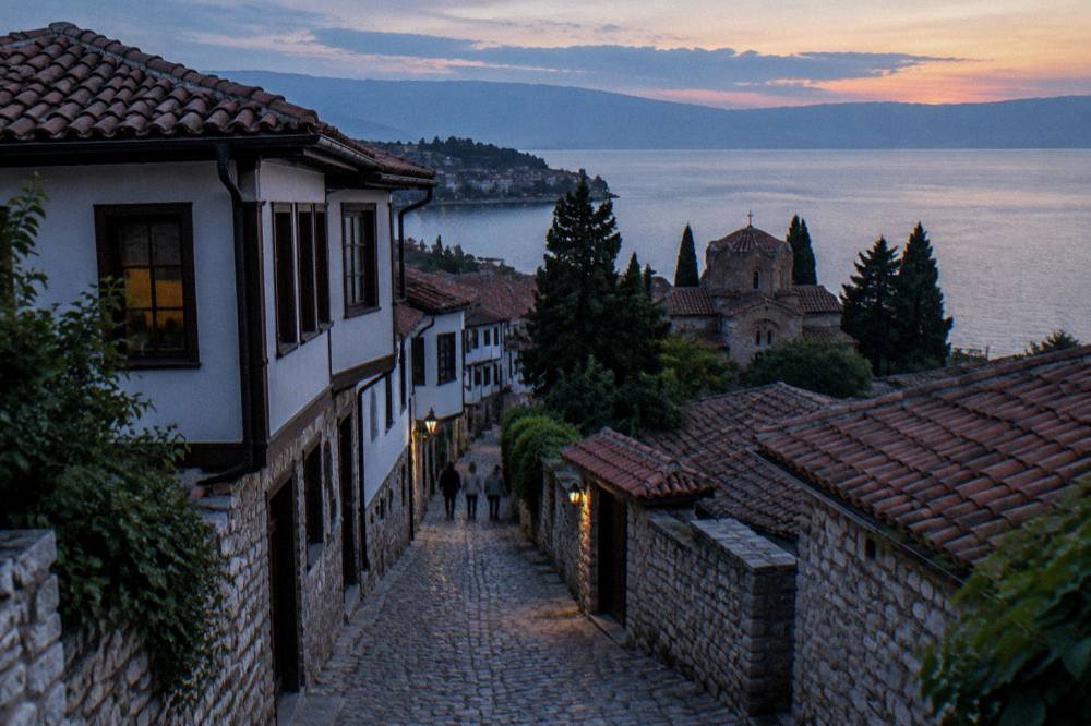 Sunset light over Lake Ohrid with the silhouette of Ohrid old town on the shore