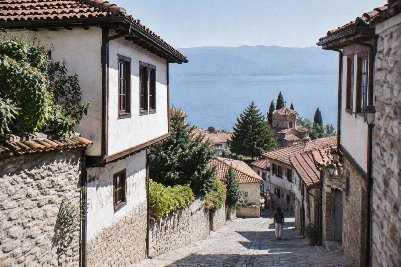 Old town rooftops of Ohrid above the blue water of Lake Ohrid under a clear sky
