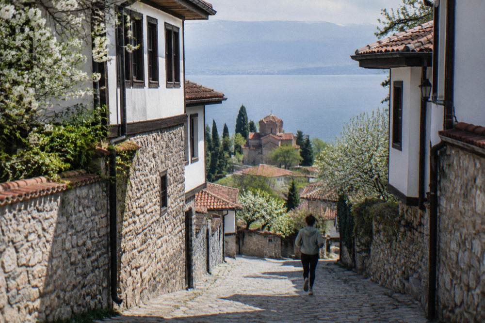 Spring greenery on the Ohrid old town hillside with the lake in the background