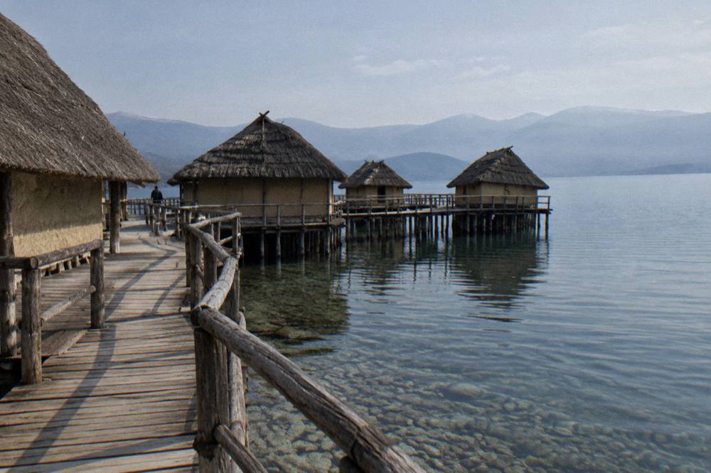 The wooden walkway of the Bay of Bones museum on stilts above Lake Ohrid