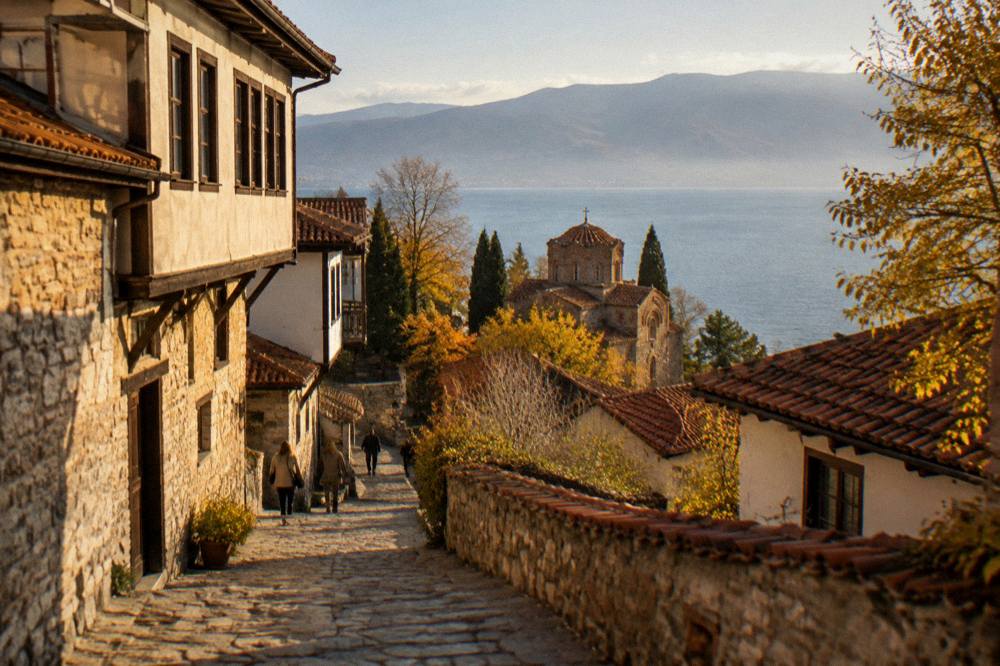 Floodlit church facade above Lake Ohrid seen from the water at nightfall