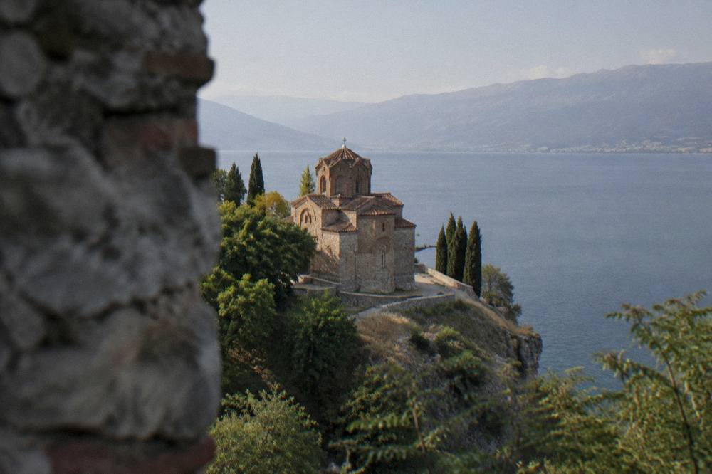 The Church of St John at Kaneo on its cliff above Lake Ohrid at dusk