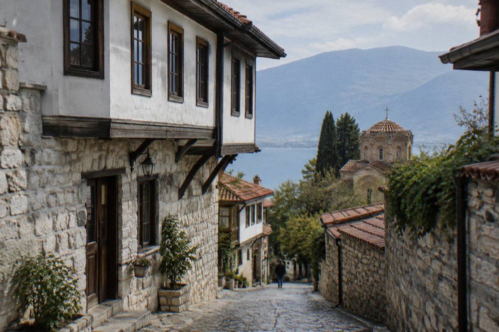 White stone facade of a nineteenth-century merchant house on a narrow Ohrid street