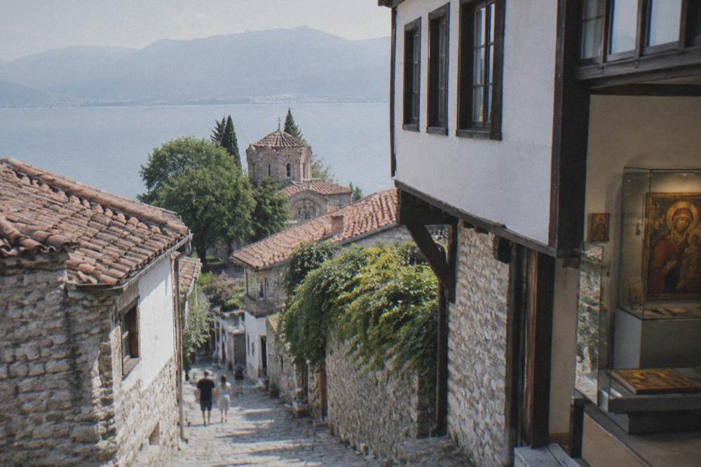 A museum interior with historic Ohrid icons displayed in glass cases