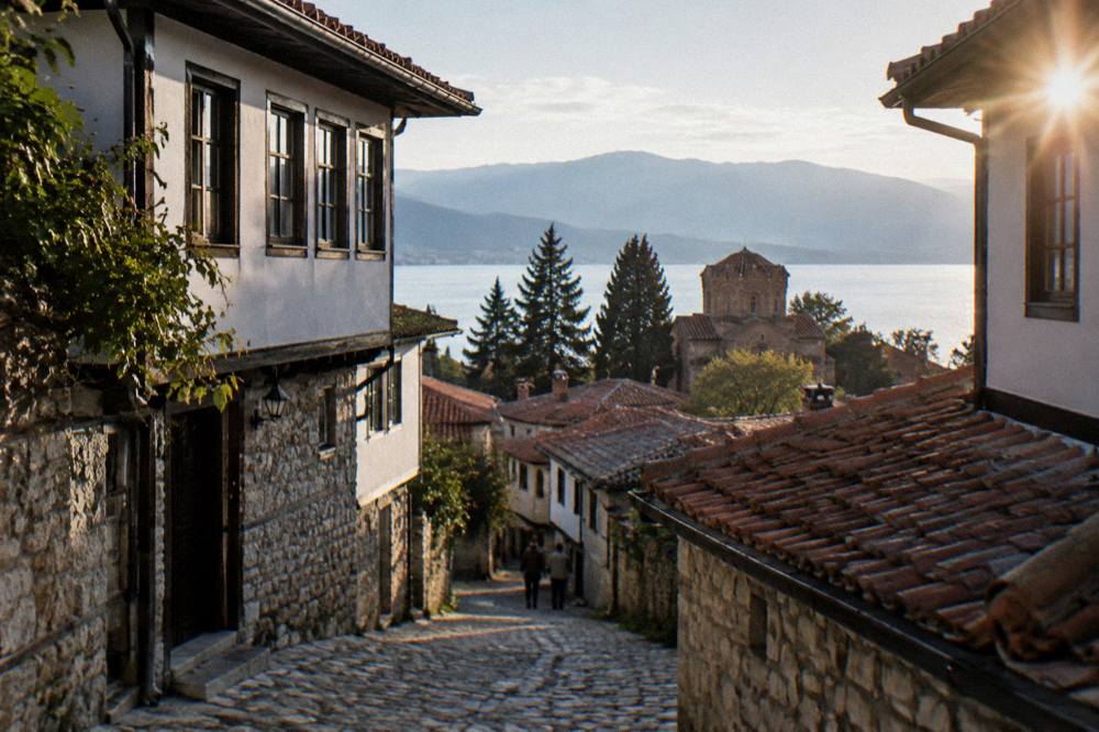 An evening skyline of a Balkan capital city with lit buildings